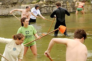 Friends of Barton Springs and other volunteers spent April 22 cleaning Barton Springs Pool as part of a number of Earth Day activities.