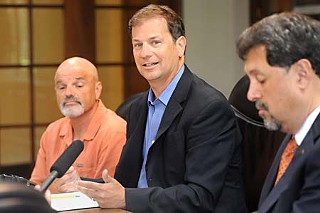 KUT director and General Manager Stewart Vanderwilt (c), joined UT Vice President for Student Affairs Juan González (r)  and station Program Director Hawk Mendenhall in announcing plans to split management of the Cactus Cafe between the Texas Union and KUT.