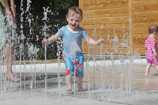 Walking on Water: Levi H. Gibbons, 20 months, enjoys the cool splash of water on a hot July day at the newly opened Clarksville Splash Pad at 1811 W. 11th. The new feature replaces the outdated wading pool at the Mary Francis Baylor Clarksville Park.
