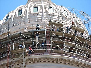 Prepping for paint: Workers set up scaffolding around the Capitol dome before adding a new coat of paint to spruce up the historic structure.