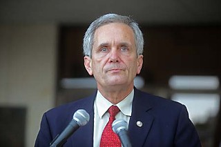 Congressman Lloyd Doggett (above) and Gov. Rick Perry are in a war of words over public education funding.