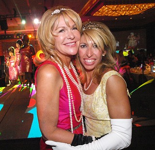 Red, Hot, & Soul's co-chairs, Mary Herr Talley (l) and Maria Groten, reveling in their triumph for the Zach fundraiser.