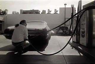 Gassing up Baby. Photograph ©1988 Butch Hancock. From <i>If I Was a Highway</i>, ©2011 Michael Ventura. Reprinted by permission of the publisher, Texas Tech University Press, <b><a href=http://www.ttupress.org/>www.ttupress.org</a></b>.
