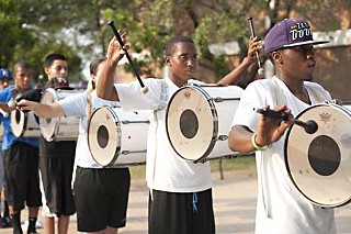 The Austin All-Stars' tenor drum section runs through drills before rejoining the entire band for practice.
