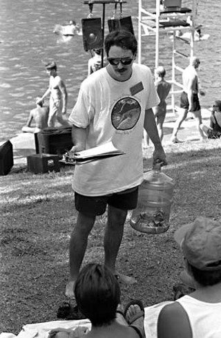 SOS leader Bill Bunch, armed with a clipboard and a money jug at Barton Springs Pool, 1994