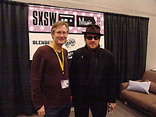 Grulke with Elvis Costello, behind the scenes at SXSW 2005
