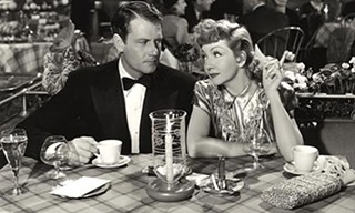 Joel McCrea and Claudette Colbert cuddle up in The Palm Beach Story