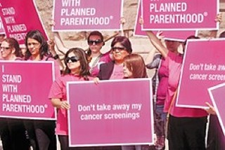 Planned Parenthood supporters rally outside the Capitol in 2011