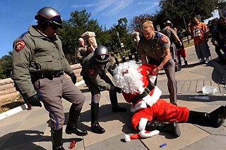On Friday afternoon, Dec. 21, Texas DPS officers arrested Santa Claus (James Peterson) for criminal mischief and evading arrest after Santa (and others) wrote with chalk on the sidewalk in front of the Capitol, words including peace, community, and love. Occupy Austin maintains this is constitutionally protected free speech; a DPS spokesman said Santa refused a request to stop chalking. See <b><a href=http://austinchronicle.com/newsdesk>Newsdesk</a></b>.