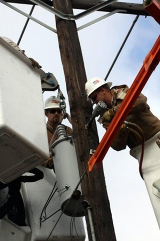 Widespread power outages had AE workers performing a different type of pole dance.