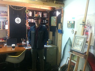 The artist in the midst of his studio, where black meets white