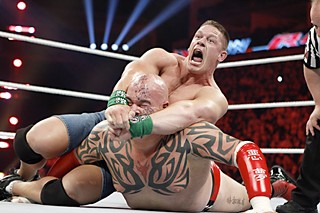 WWE main eventer John Cena (<b>@JohnCena</b>, 3,478,709 Twitter followers) locks the STFU on Lord Tensai (<b>@WWETensai</b>, 44,285 Twitter followers).