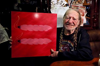 Willie Nelson aboard the <i>Honeysuckle Rose</i> on March 27, with a marriage equality symbol reconceived by <i>Texas Monthly</i> music writer and KGSR deejay Andy Langer and designed locally by Christian Helms of Helms Workshop