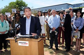 AISD Board President Vincent Torres at a Tuesday press conference at Eastside Memorial to discuss the new partnership. Among those shown behind Torres are trustee Ann Teich, Superintendent Meria Carstarphen, former Mayor Gus Garcia, trustee Gina Hinojosa, and Education Austin's Ken Zarifis.
