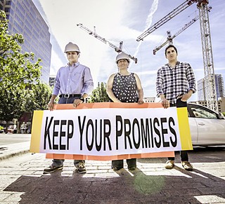 L-R: Former construction worker Christian Hurta­do, WDP member and construction worker Juana Silva, and WDP volunteer Jorge Ramir­ez, across the street from the Marriott project on Congress, with a sign calling on White Lodging to keep its promise on wages.