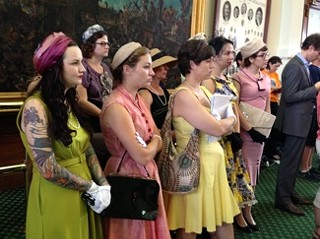 Women dressed for another era to protest Texas' proposed rollback of reproductive rights