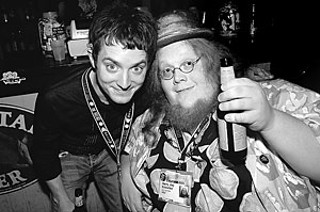 Elijah Wood (l) hangs with Austin's own Harry Knowles (Ain't It Cool News) during SXSW 2006.