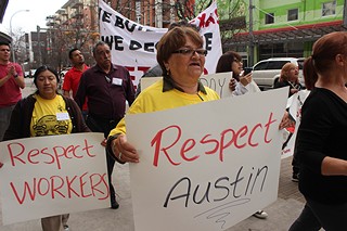 Margarita Ludueña holds a Respect Austin sign, followed by Julia de Leon with a Respect Workers sign as they march to the federal courthouse Feb. 1 in a symbolic plea for the court to reject White Lodging's lawsuit against the city of Austin – filed after the city revoked a fee waiver deal based on pay for construction workers. The Workers Defense Project and Save Our Springs Alliance have filed legal briefs defending the city's actions.