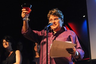 Madge Darlington of the Rude Mechanicals toasts the crowd in fitting Critics Table style during the company's induction into the Austin Arts Hall of Fame