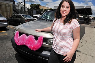 Lyft driver Taylor Milstead and her mustachioed car