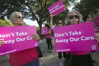 Protesters in support of Planned Parenthood demonstrate at a hearing on the alleged 