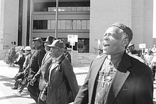Ministers from the Baptist Ministers Union of Austin and members of their congregations marched from Austin Police Headquarters to City Hall in protest of the recent actions of the APD.