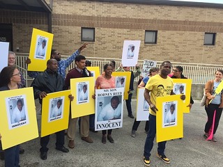 Rodney Reed's supporters rally outside of the Bastrop County Sheriff's Office following Tuesday's hearing.