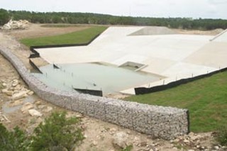 Concrete dam, with detention pond above right, and secondary rock  filter below dam where water enters Lick Creek stream bed