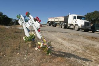 Crosses mark the spot where the Jacobsons died on 
Highway 71.