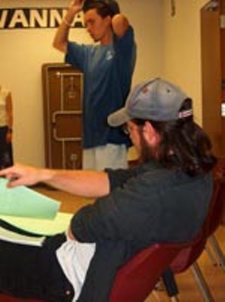 Writer Cliff Coats (seated) and director Aaron SAnders work out the kinks of their new play, <i>Terminal</i>.