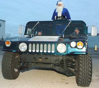 Those aren’t reindeer: Blue Santa - the APD’s version of the Jolly Old Elf - went around town in something considerably bigger than a sleigh delivering toys to needy children on Saturday. The tradition has helped brighten the holidays for underprivileged kids since 1972. To donate or volunteer, call 220-BLUE,
or go to <a href=http://www.bluesanta.org target=blank><b>www.bluesanta.org</b></a>.