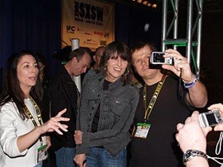 Chrissie Hynde greets fans and photographers after her 
interview where she minced no words (You don't have to 
take an intelligence test to become a celebrity) and 
answered questions about the history of the Pretenders.
