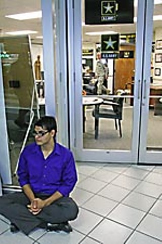  Jesus Sanchez engages in a sit-in at the military recruitment center at Dobie Mall.