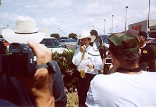 Republican congressional candidate Grant Rostig praises the Minutemen at a 9/11 rally in Laredo.
