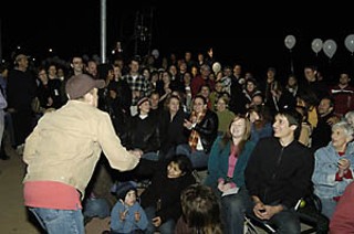 Martin Burke (l) tossing apples. Can you spy Suzan-Lori Parks in the crowd?