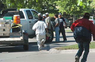 Day laborers solicit work in North Austin.
