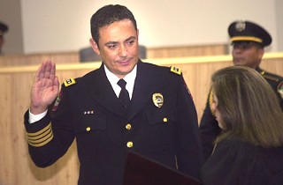 Waving flames from disposable lighters and a rendition of “Free Bird” were the only elements missing from the rock-star reception that greeted new Austin Police Chief Art Acevedo during his swearing-in ceremony July 19 at City Hall. It was standing-room-only at the 10am event in council chambers, which were packed with Acevedo’s friends, family, and colleagues from California – where he served with the California Highway Patrol for more than 20 years before being selected last month to take over as the Austin Police Department’s top cop. Acevedo was sworn in as the department’s eighth chief and its first Hispanic leader. Numerous police and paramedics (including a contingent of cops from APD’s sister department in Saltillo, Mexico), a swath of community activists, and countless local officials assembled to welcome Acevedo, who told the crowd that he’s “ready to work” on the problems and challenges facing the department and is “really, really looking forward” to the job. “And I promise you,” he said, “I don’t scare easily.” – <i>Jordan Smith</i>