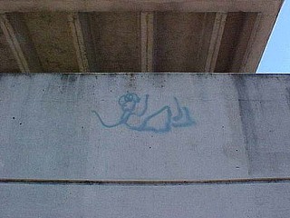 Another famed example of Austin graffiti art recently succumbed to the
paintbrush. We’re talking the female stick figure who jumped to her
death on the side of the Stokes Parking Garage at 12th and Guadalupe.
The beskirted lass tumbled, twisted, and turned on each floor. Her final
landing was painted over years ago, but the entire artwork recently
disappeared under dull brown paint. Color it one more sign of the
Dallasization of “weird Austin,” more of a T-shirt slogan than a reality
these days. We gave the leaping lass a “Best of Austin” award for Best
Physical Graffiti back in 2001. May she rest in peace.   – <i>Joe O’Connell</i>