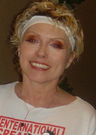 Deborah Harry wearing Austin jewelry designer Kevin Heady's custom-designed bezel-set ruby Y necklace with black spinel in 14-karat yellow gold (<b><a href=http://www.kevenheady.com/>www.kevenheady.com</a></b>)

<br clear=all>