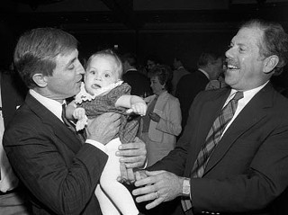 Earle kissing babies on the campaign trail