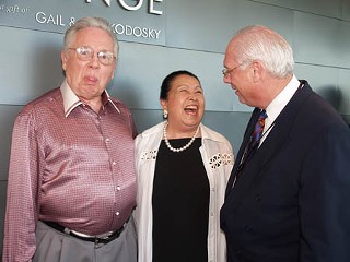 Joe R. and Teresa Lozano Long (l and c) share a moment of humor with Cliff Redd at the Catalyst Eight benefit 
for the Long Center.