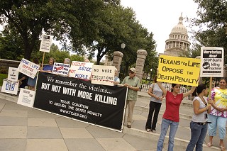 Death penalty opponents rally Tuesday outside the Capitol.