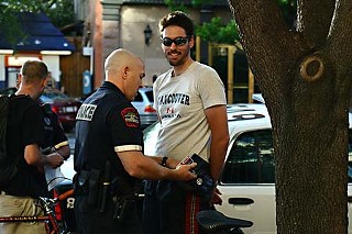 Austin Police Officer Jason Mistric arrests Nathaniel Hill during a recent Critical Mass ride.