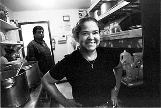 Enriquetta Gonzalez, a resident of Casa Marianella, also serves as Casa's volunteer cook.