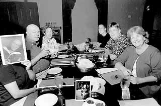 The woman holding an image of writer Sarah Bird to her face is <i>Chronicle</i> marketing director Tommi Ferguson, seated next to Tom Doyal and Mary Willis Walker. Across from them are (l-r) Amanda Eyre Ward, Jim Burr, and Anne Dingus. Bird, Tom Grimes, and Carol Dawson were also judges but were unable to attend the judges' dinner at The Clay Pit.