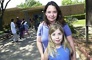Teresa Van Deusen and Nika Perry in front of Maplewood Elementary, 2002
