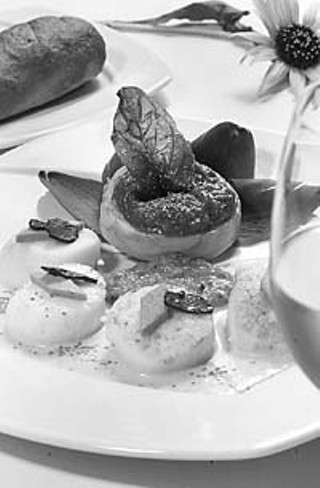 Roasted diver scallops with a saffron sauce, foie gras, fried artichoke, and truffles