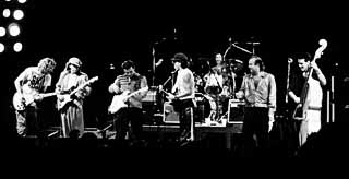 Riverfest, 1985 (l-r): Joe Walsh,  Stevie Ray Vaughan, Jimmie Vaughan, Carlos Santana,  Fran Christina, Kim Wilson, and Preston Hubbard