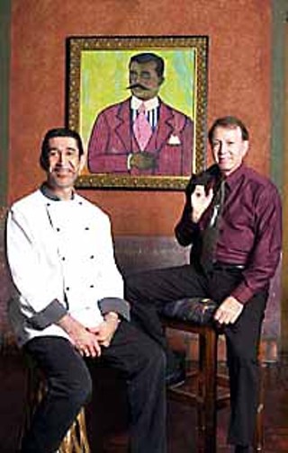 Fonda San Miguel's Executive Chef Miguel Ravago and owner Tom Gilliland in front of Daniel Brennan's <i>Zapata</i>, the first painting they bought for the restaurant