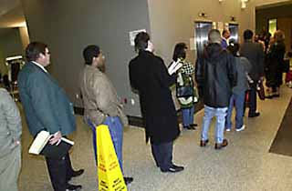 Every morning, long lines form at the Justice Center's overworked elevators.